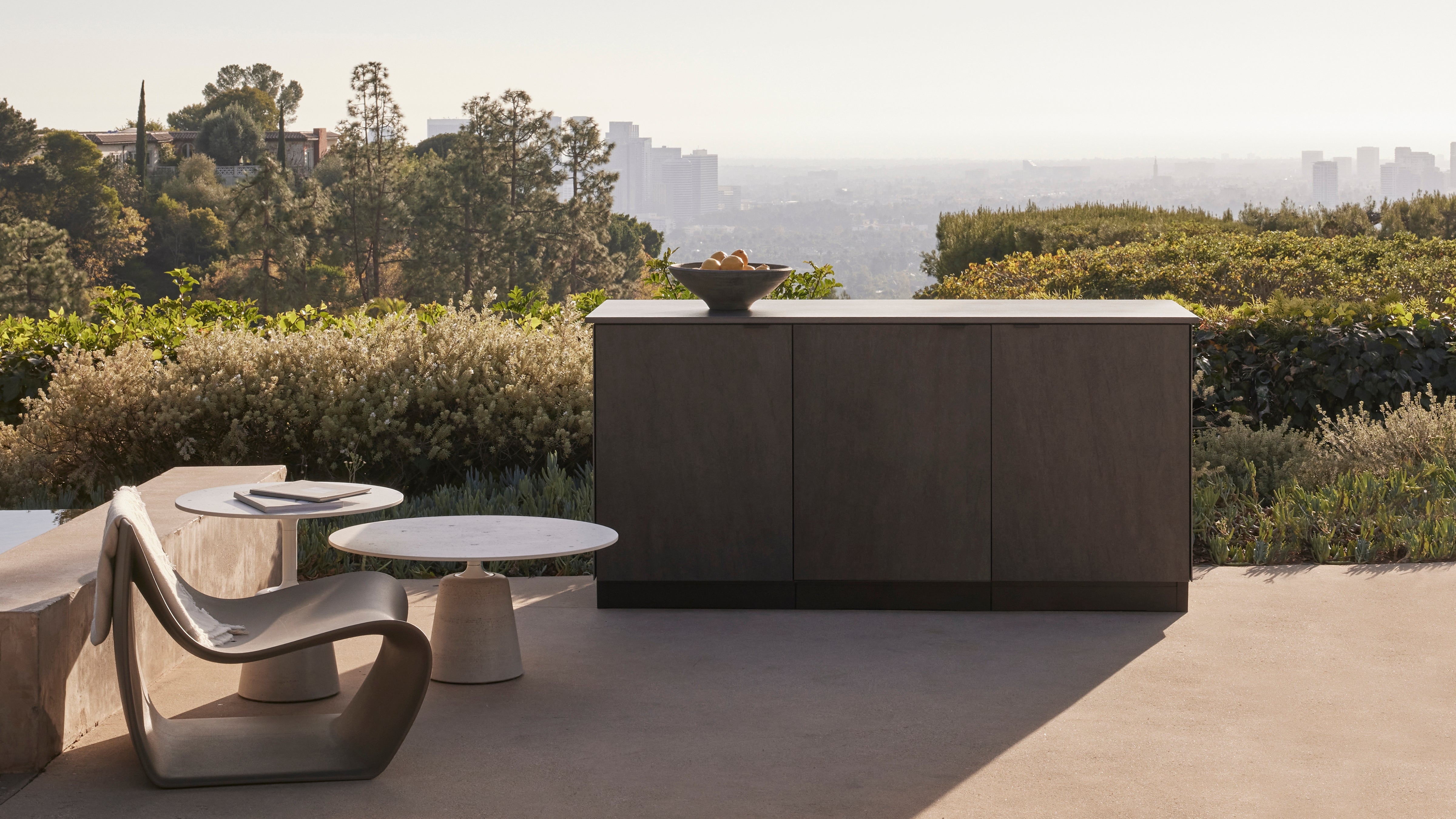 Poolside outdoor kitchen with Los Angeles skyline