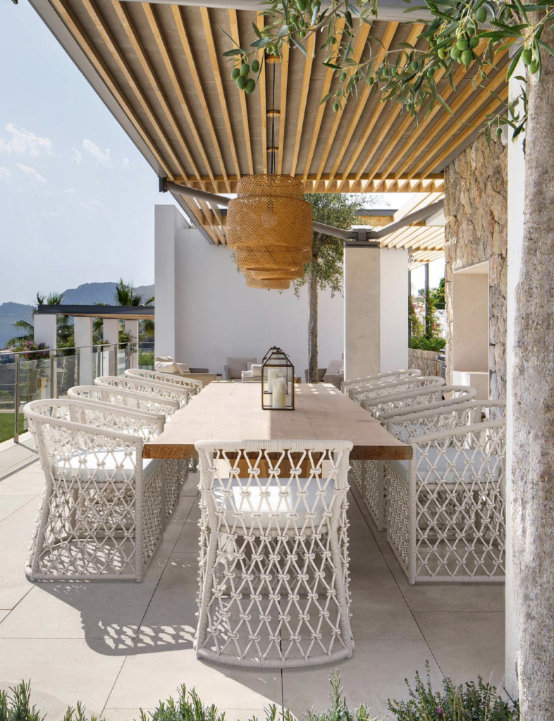 Outdoor furniture set under a louvered pergola