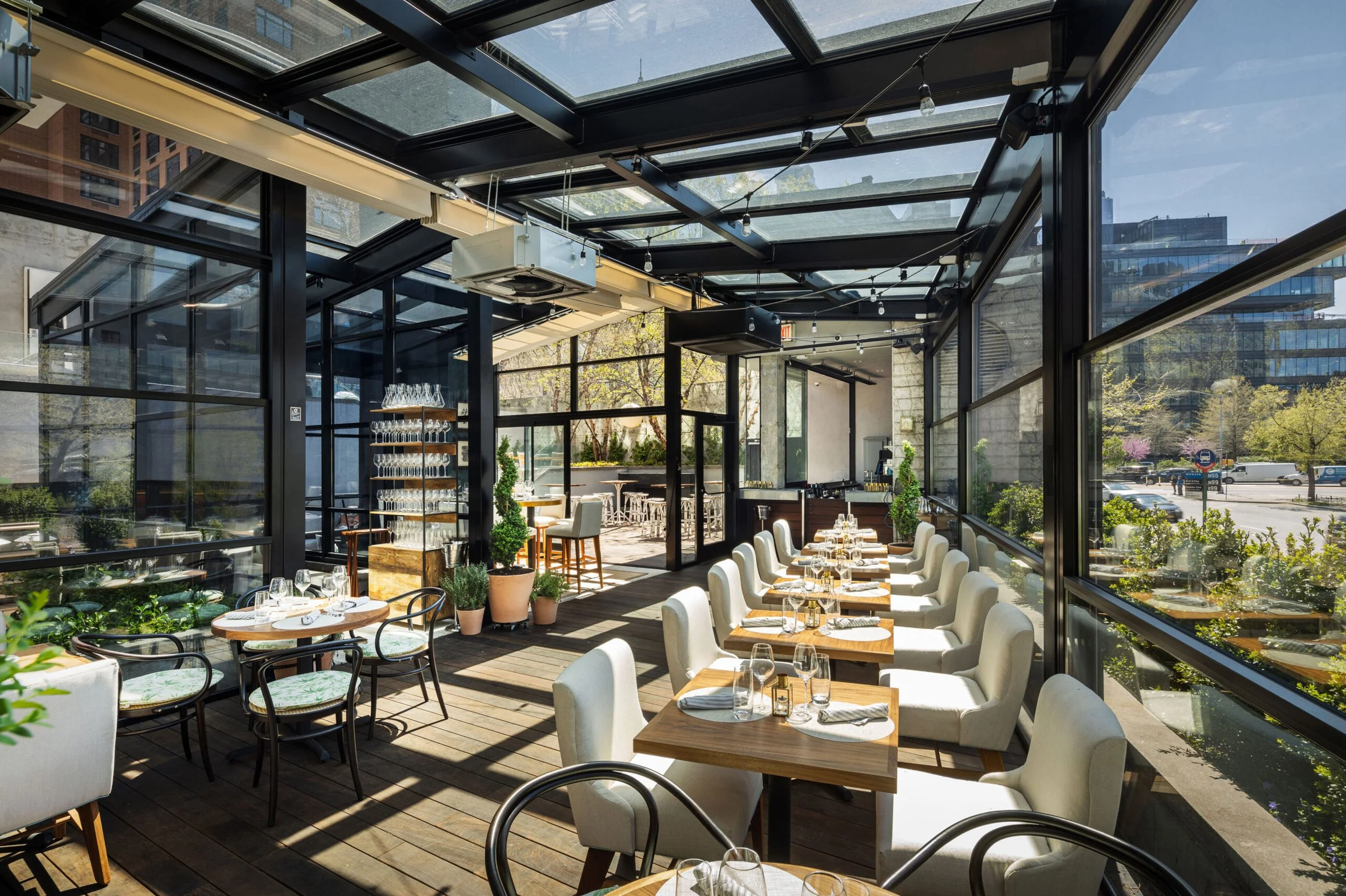 Glass wall integrated with a pergola structure