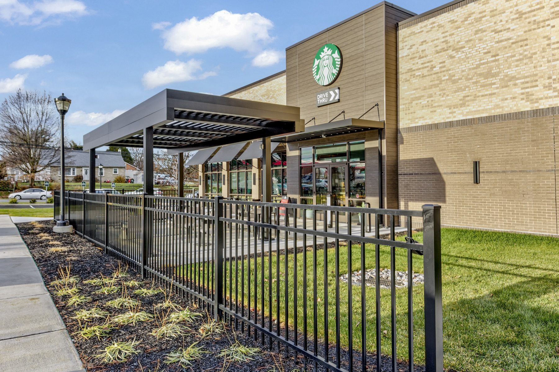 Commercial aluminum pergola covering an outdoor restaurant dining area