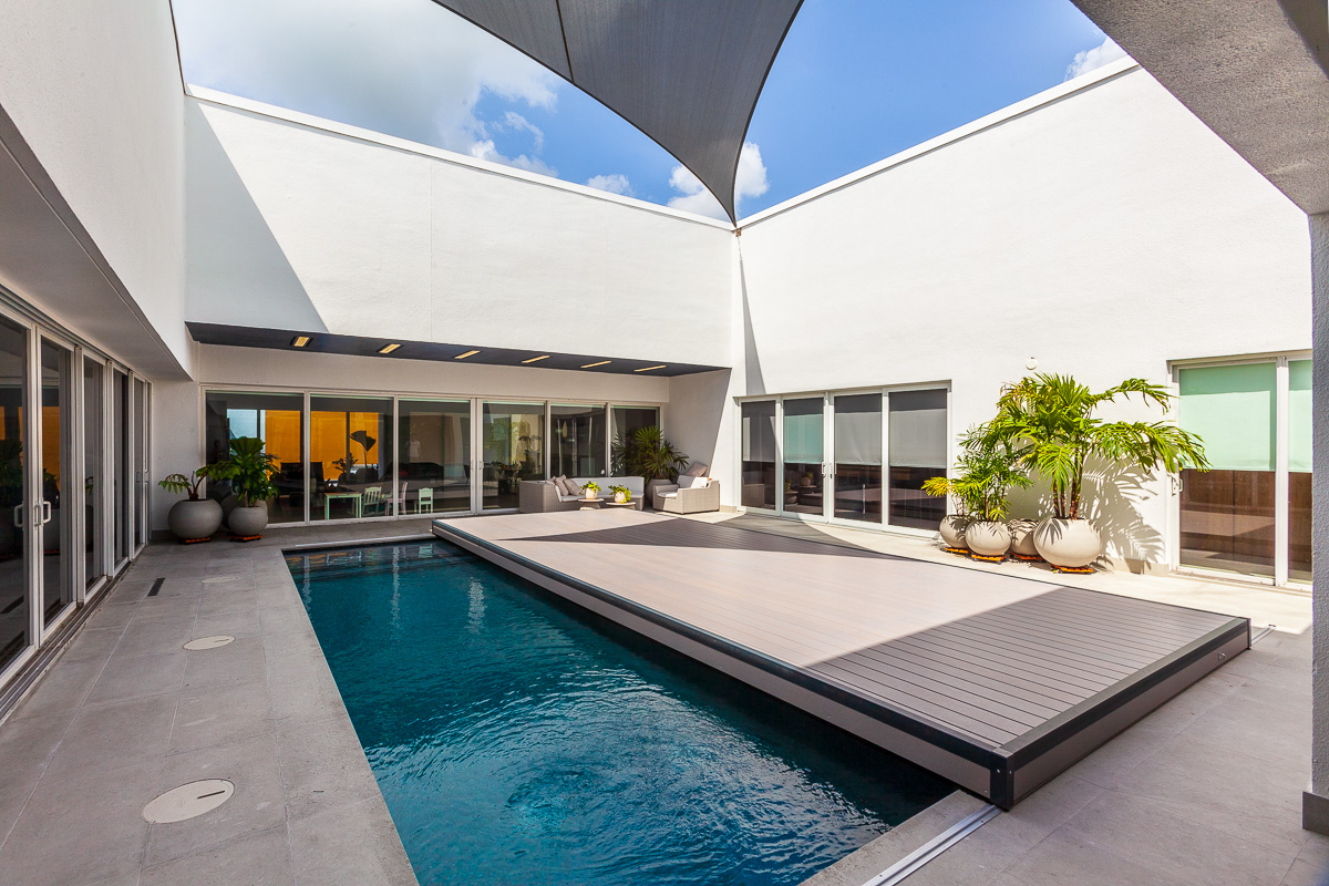 S-LIDE sliding deck pool cover — closed and walkable