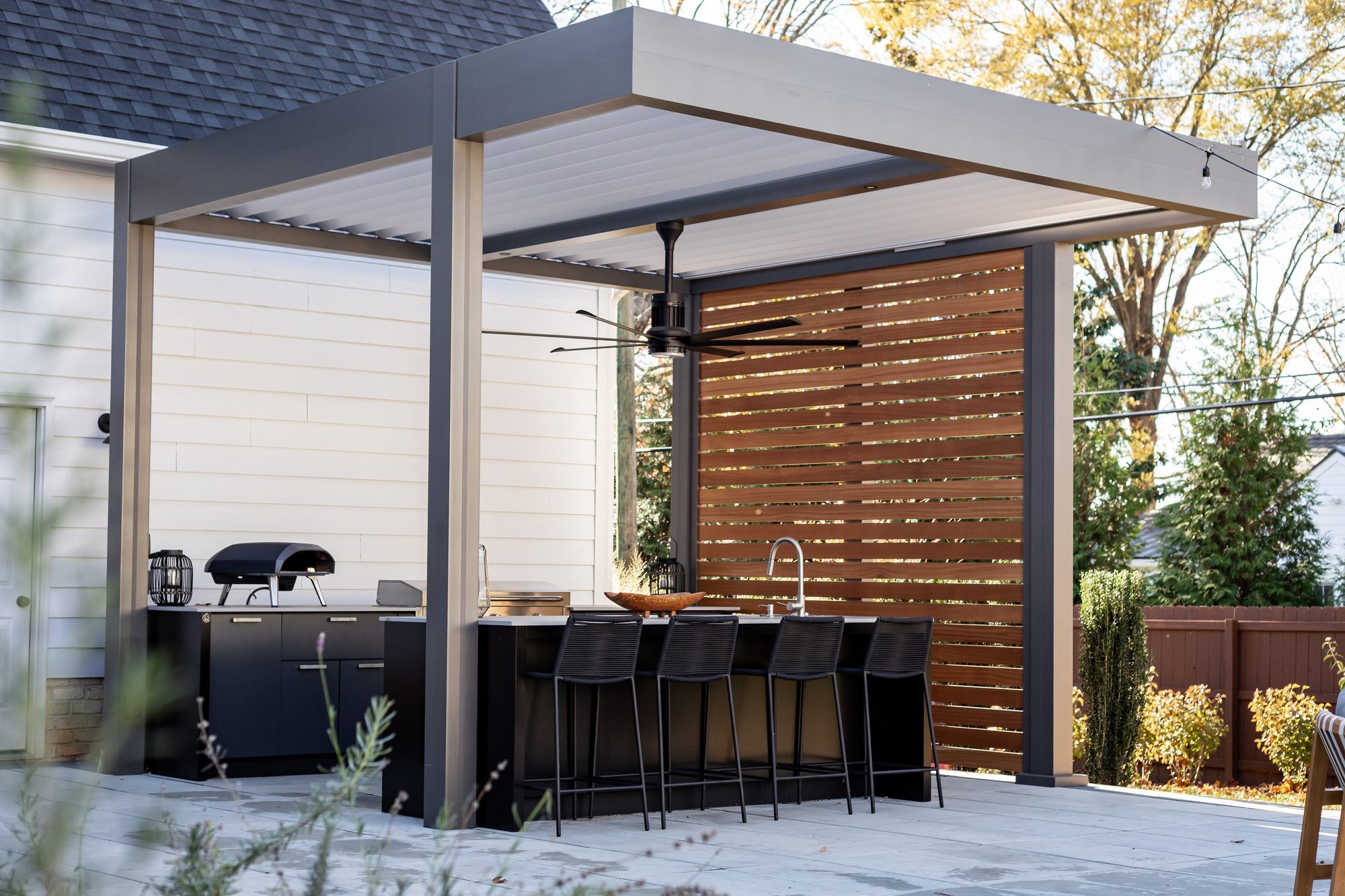 Wood-look aluminum pergola finish complementing a California home exterior
